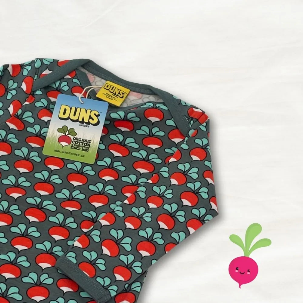 Baby romper with mushroom pattern and DUNS branding on a white background