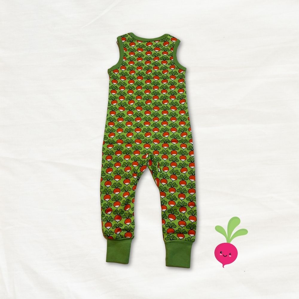 Green children's dungarees with radish pattern on a white background