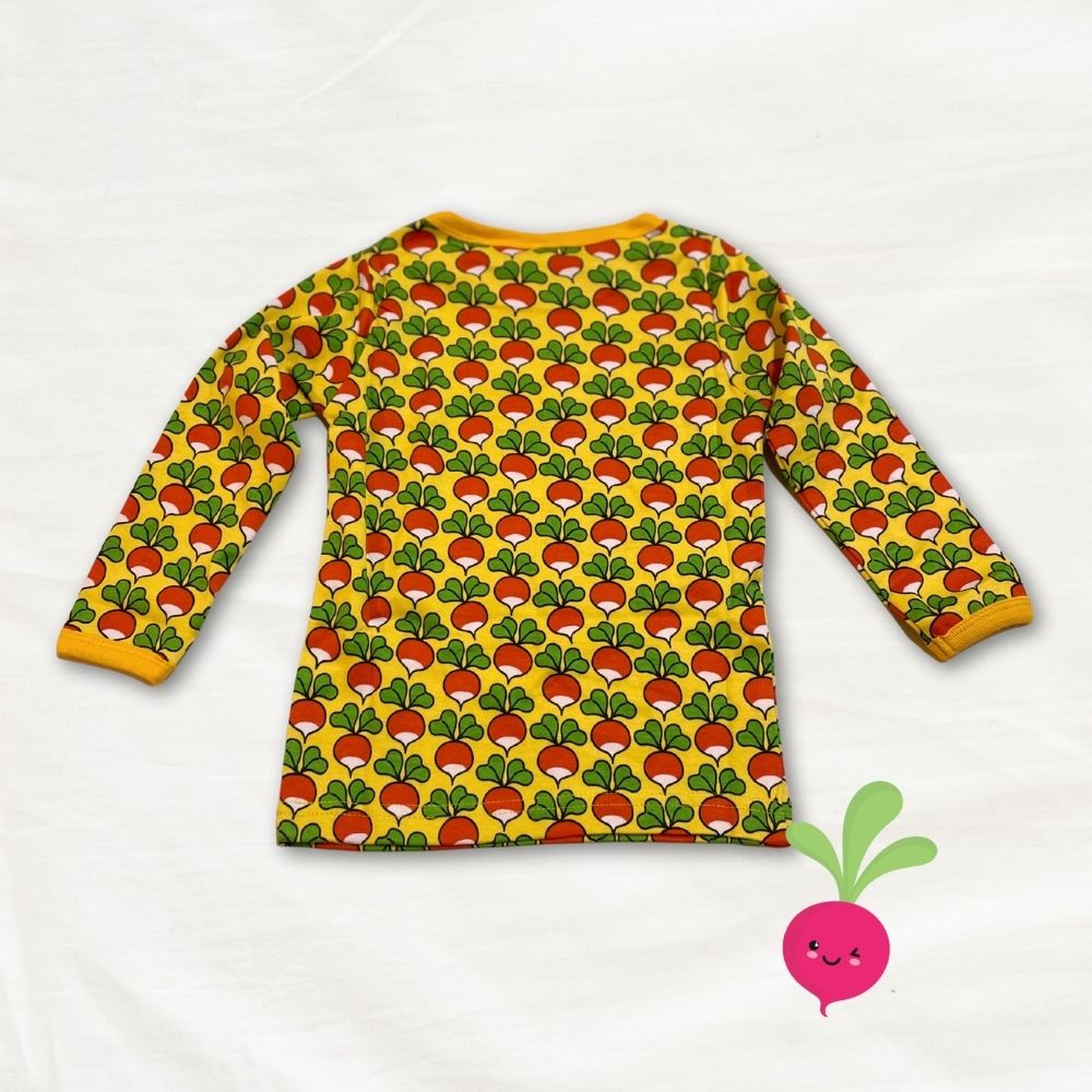 Children's long-sleeve shirt with radish pattern on a white background