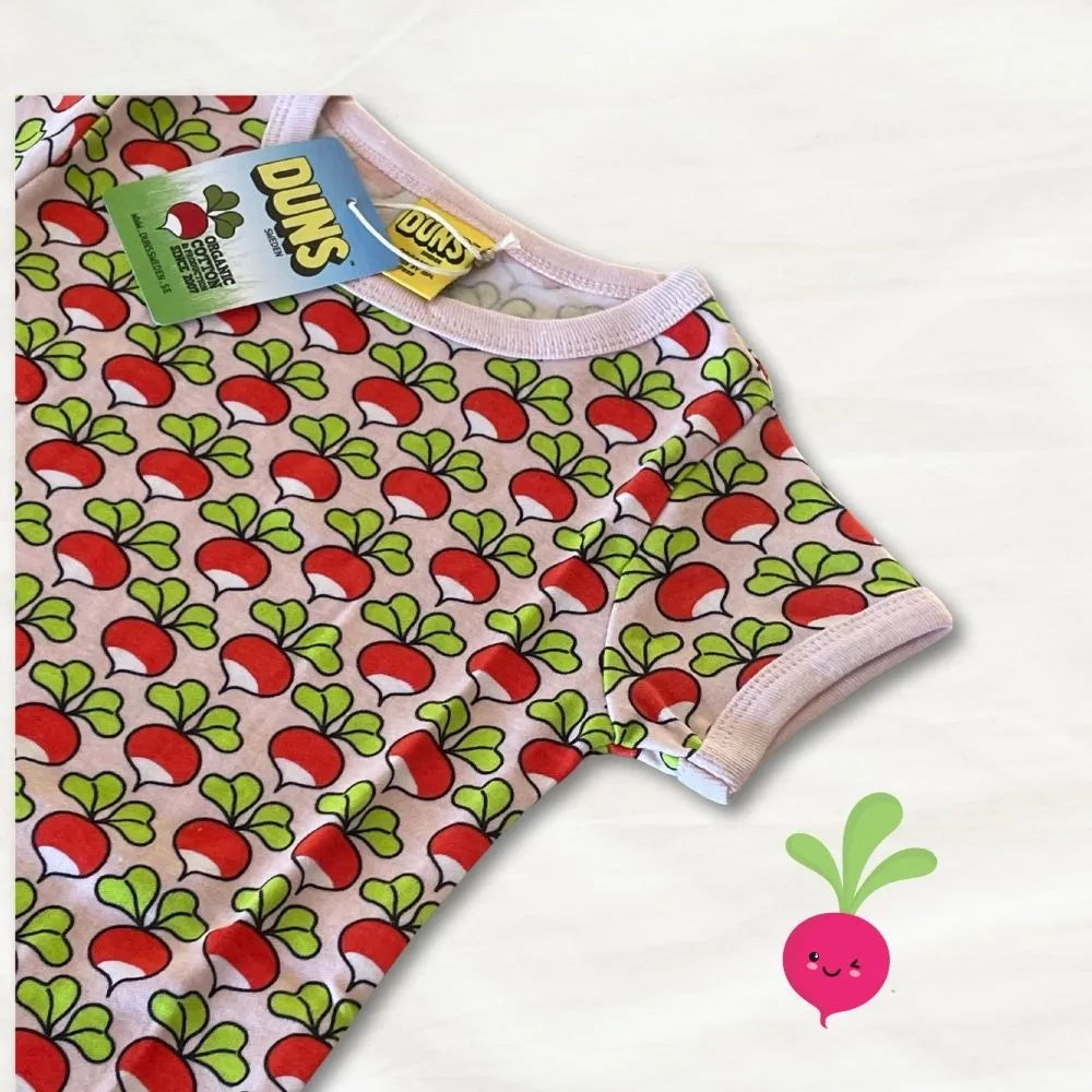 Baby romper with radish pattern and DUKS branding on a white background