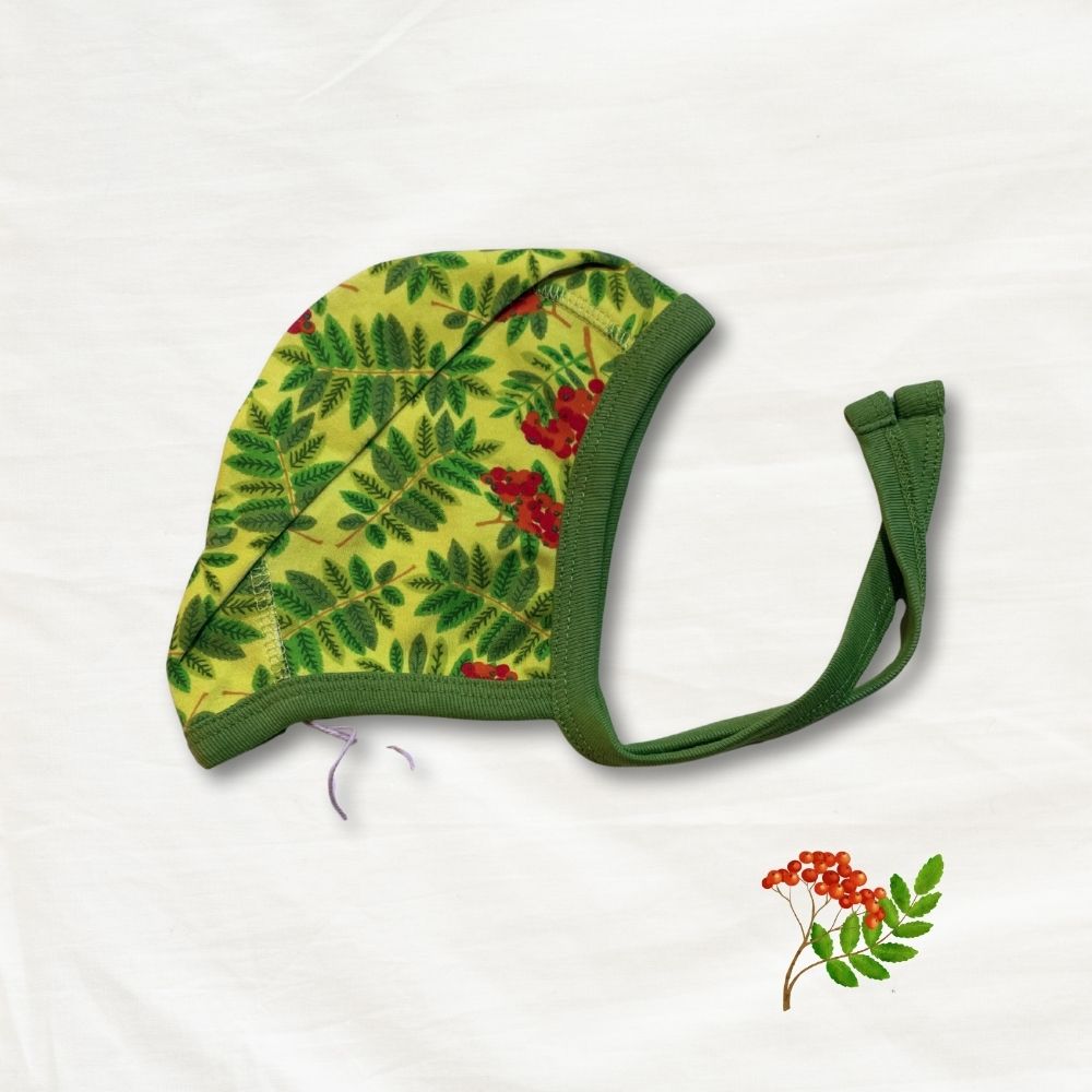 Baby hat with leaf pattern on a white background