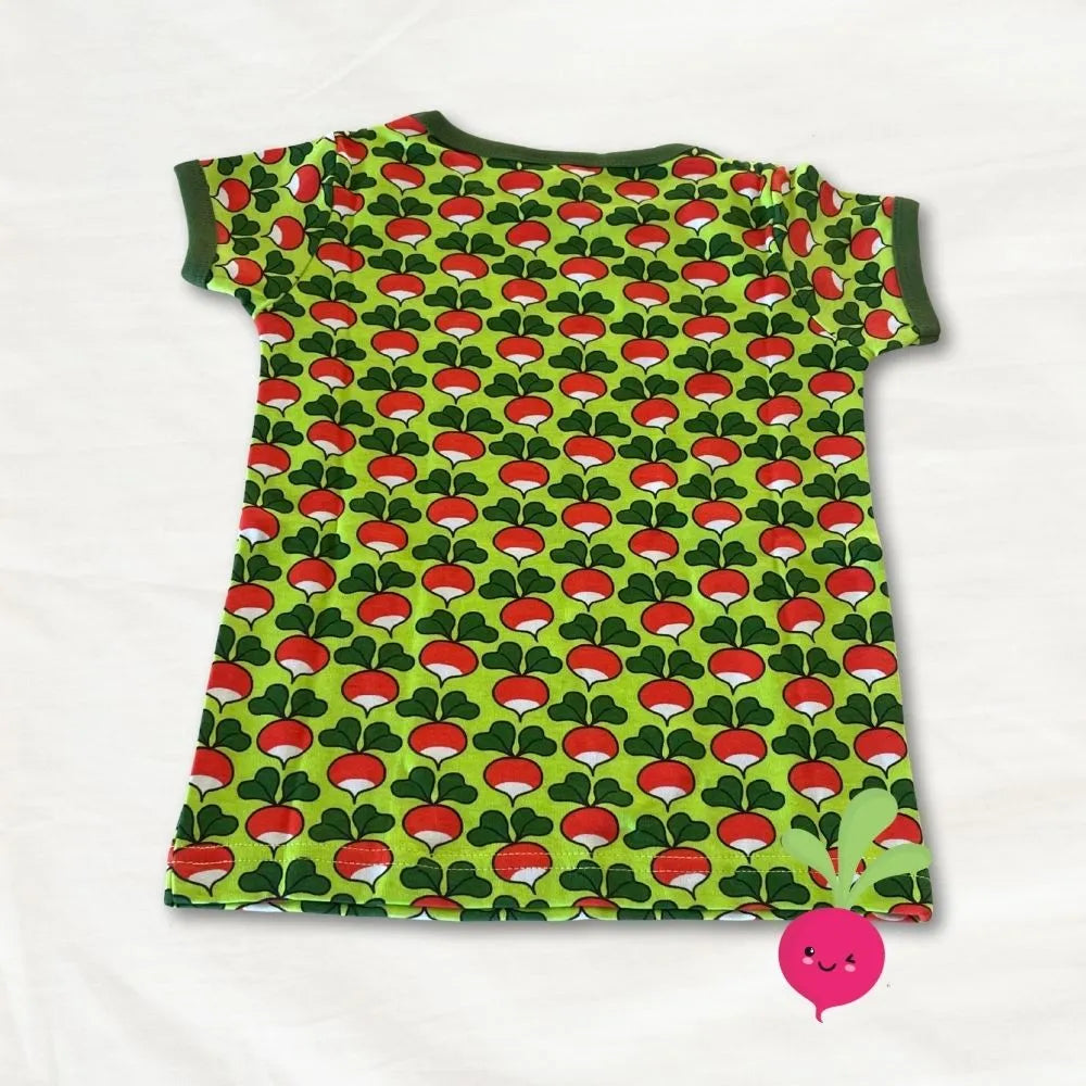 Green t-shirt with red mushroom pattern on a white background