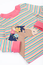 Colorful striped poncho with a horse design on a white background