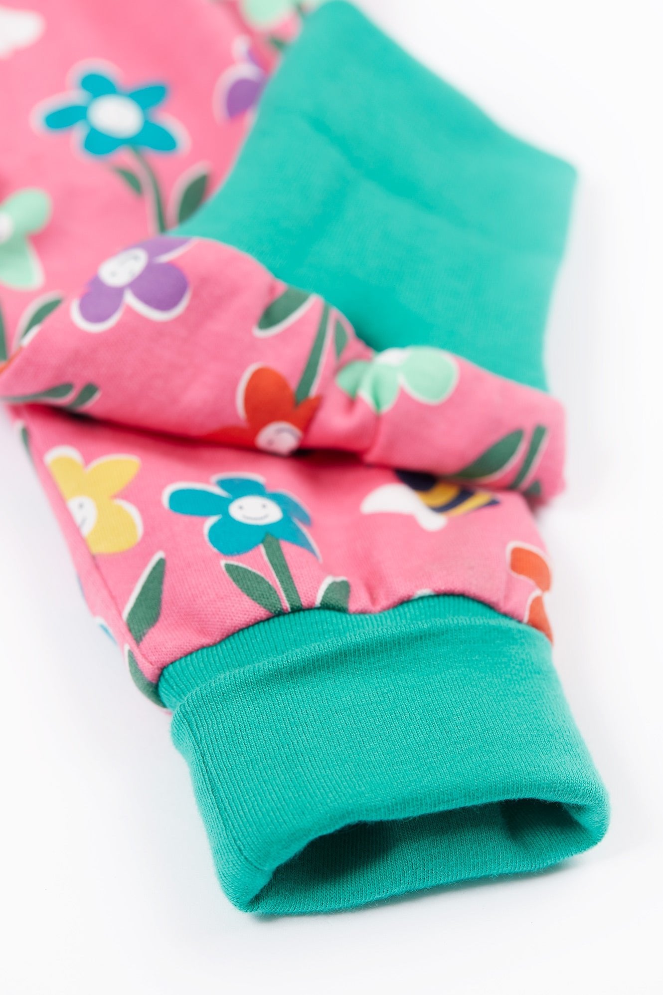 Pair of colorful floral-patterned socks on a white background