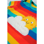 Colorful children's outfit with a sun and cloud design on a white background
