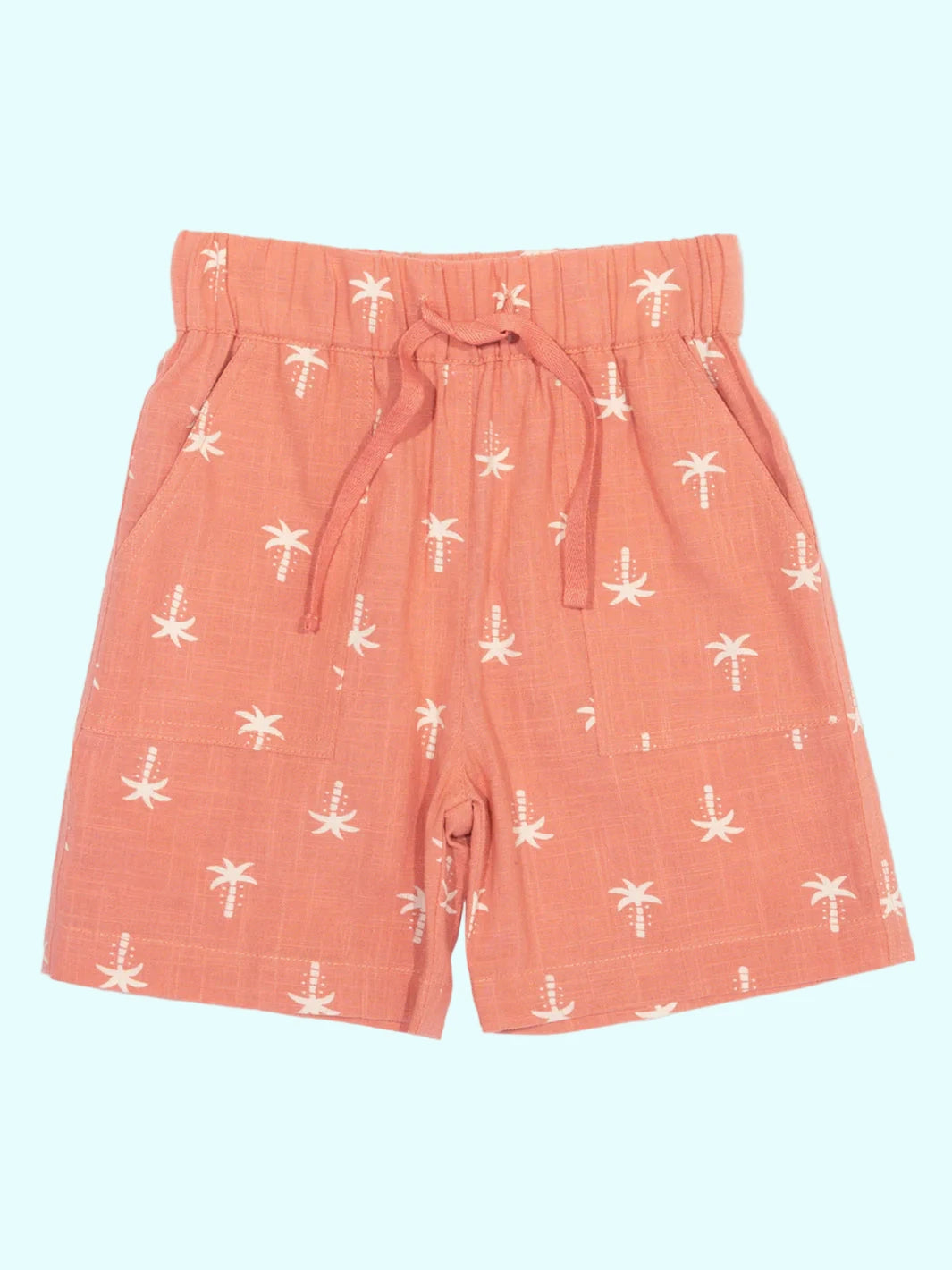 Coral shorts with white palm tree pattern on a white background