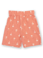 Coral shorts with white palm tree pattern on a white background