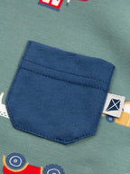 Close-up of a blue pocket on a fabric with colorful patterns, featuring a brand label.