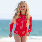 Girl in red long sleeve kite swimsuit