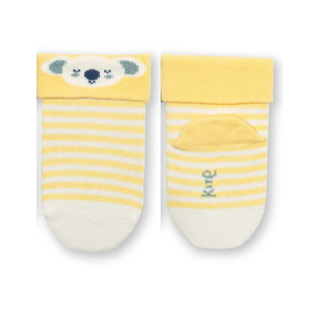 Pair of baby socks with yellow and white striped pattern on a white background