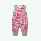 Pink children's romper with floral and animal pattern on a white background