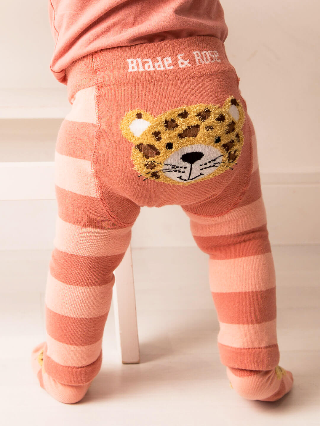 Striped leggings with a jaguar face patch and 'Blade & Rose' branding on a white background