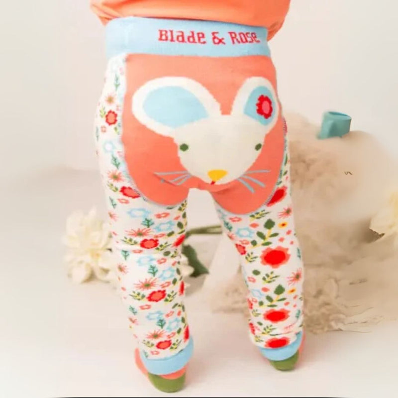 Children's leggings with a cartoon mouse design and floral pattern on a white background.