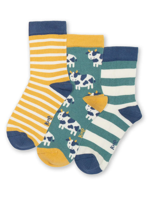 Three pairs of socks with different patterns on a white background