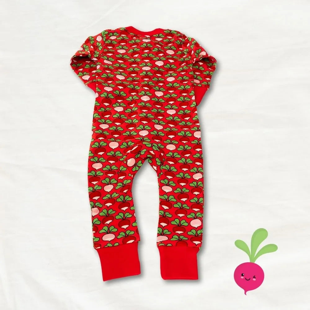 Red baby onesie with green and pink pattern on a white background