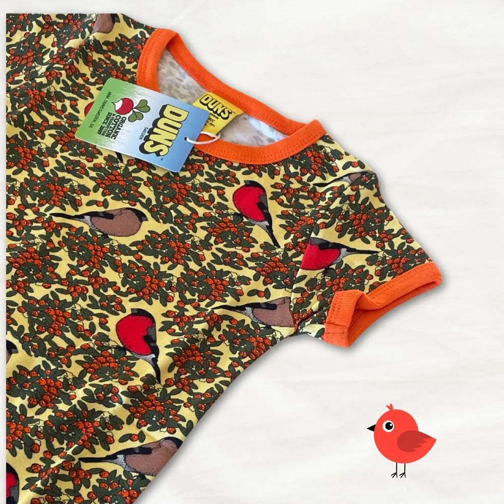 Baby romper with bird and berry pattern on a white background
