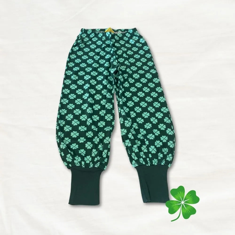 Green pants with clover pattern on a white background