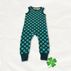 Children's romper with clover pattern on a white background