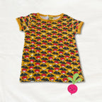 Yellow dress with colorful mushroom pattern on a white background