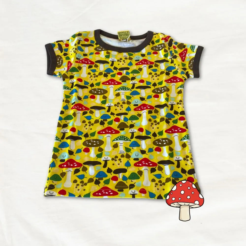 Children's dress with mushroom pattern on a white background