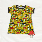 Children's dress with mushroom pattern on a white background