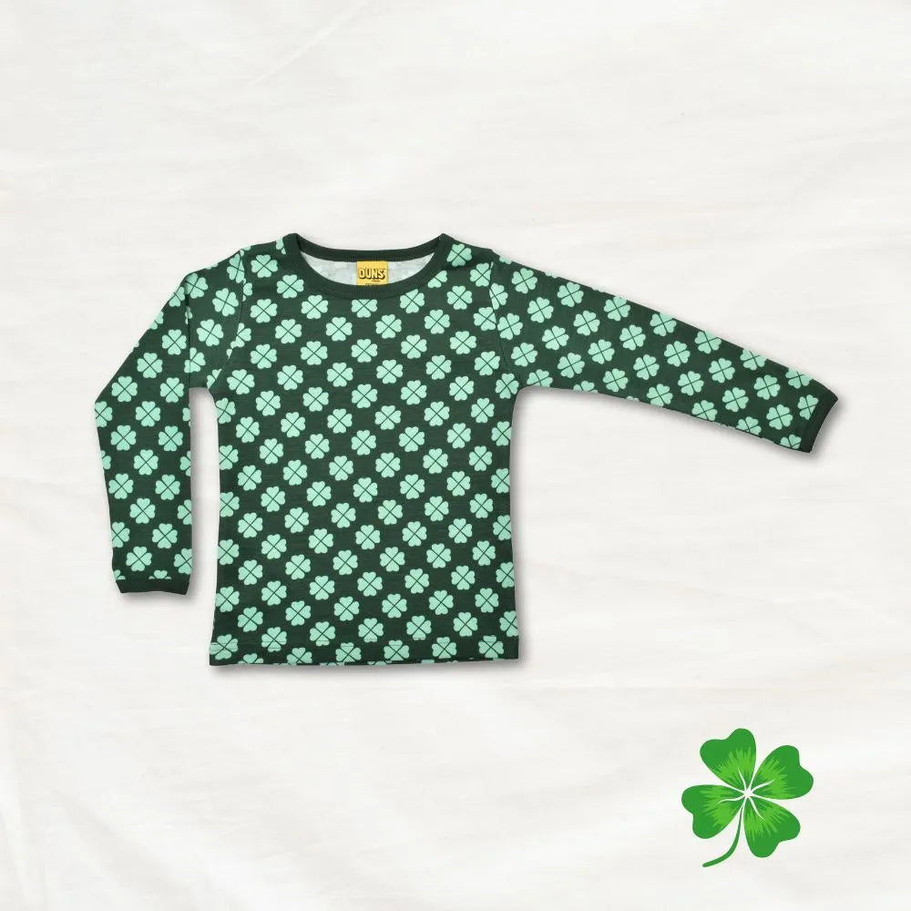 Green long-sleeve shirt with clover pattern on a white background