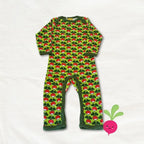 Green baby onesie with red and white pattern on a white background