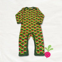 Green baby onesie with red and white pattern on a white background