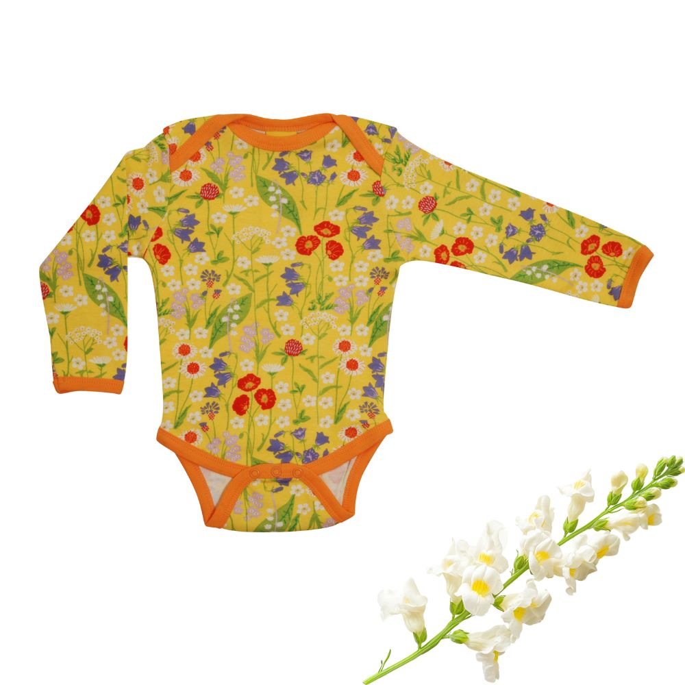 Floral-patterned baby onesie with orange trim on a white background
