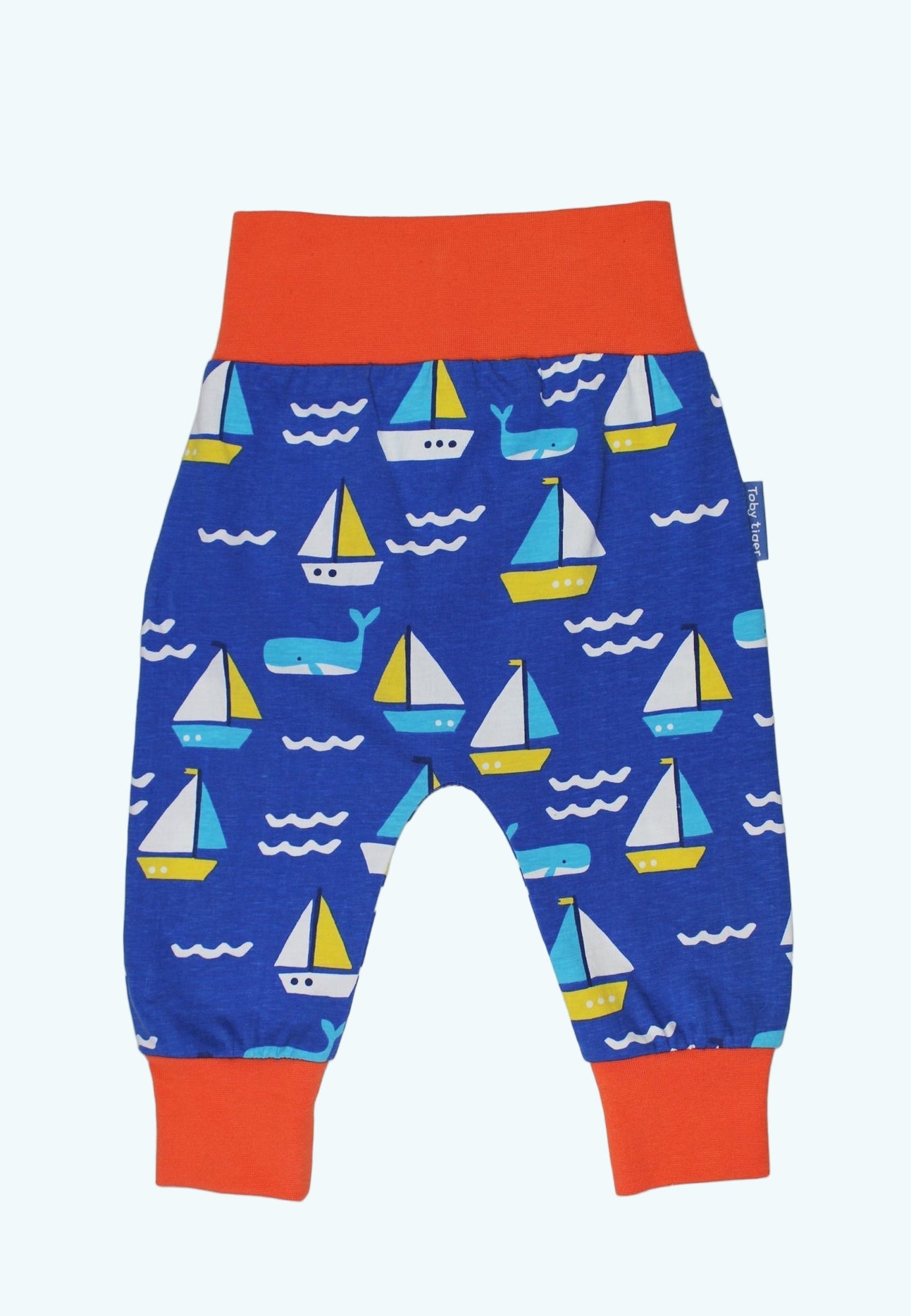 Children's pants with sailboat pattern on a white background
