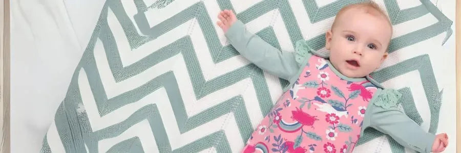 Baby in cute organic dungarees