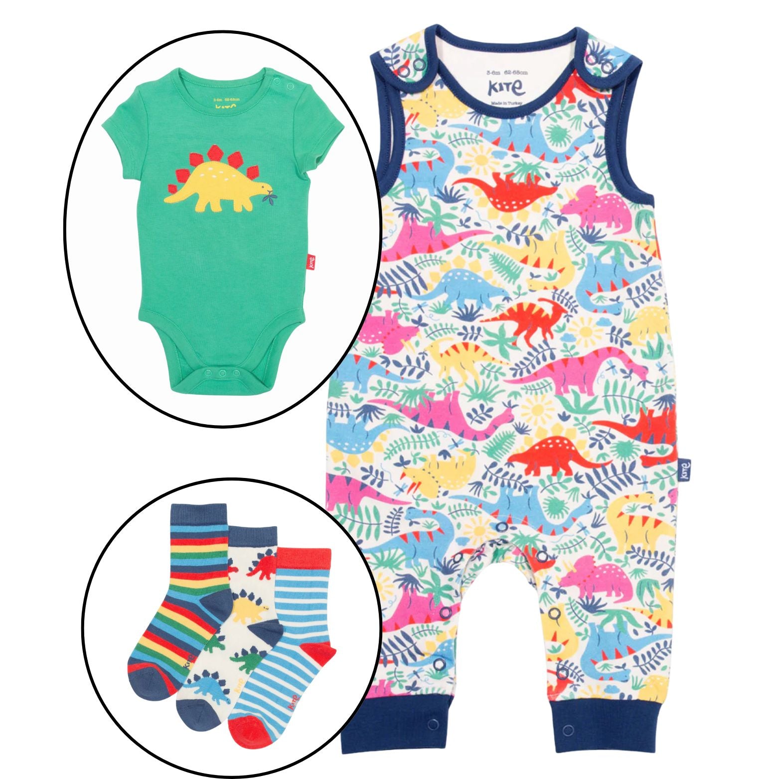 Baby outfit set with green bodysuit, colorful dinosaur-patterned romper, and striped socks on a white background.