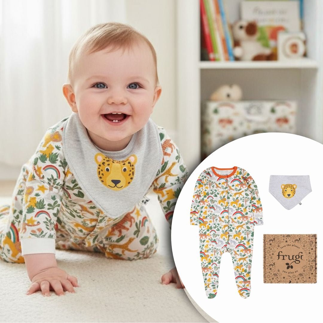 Baby wearing frugi infant unisex clothing gift set with tiger on bib