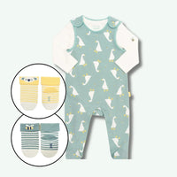 Baby romper with duck pattern and inset images of baby socks on a light blue background