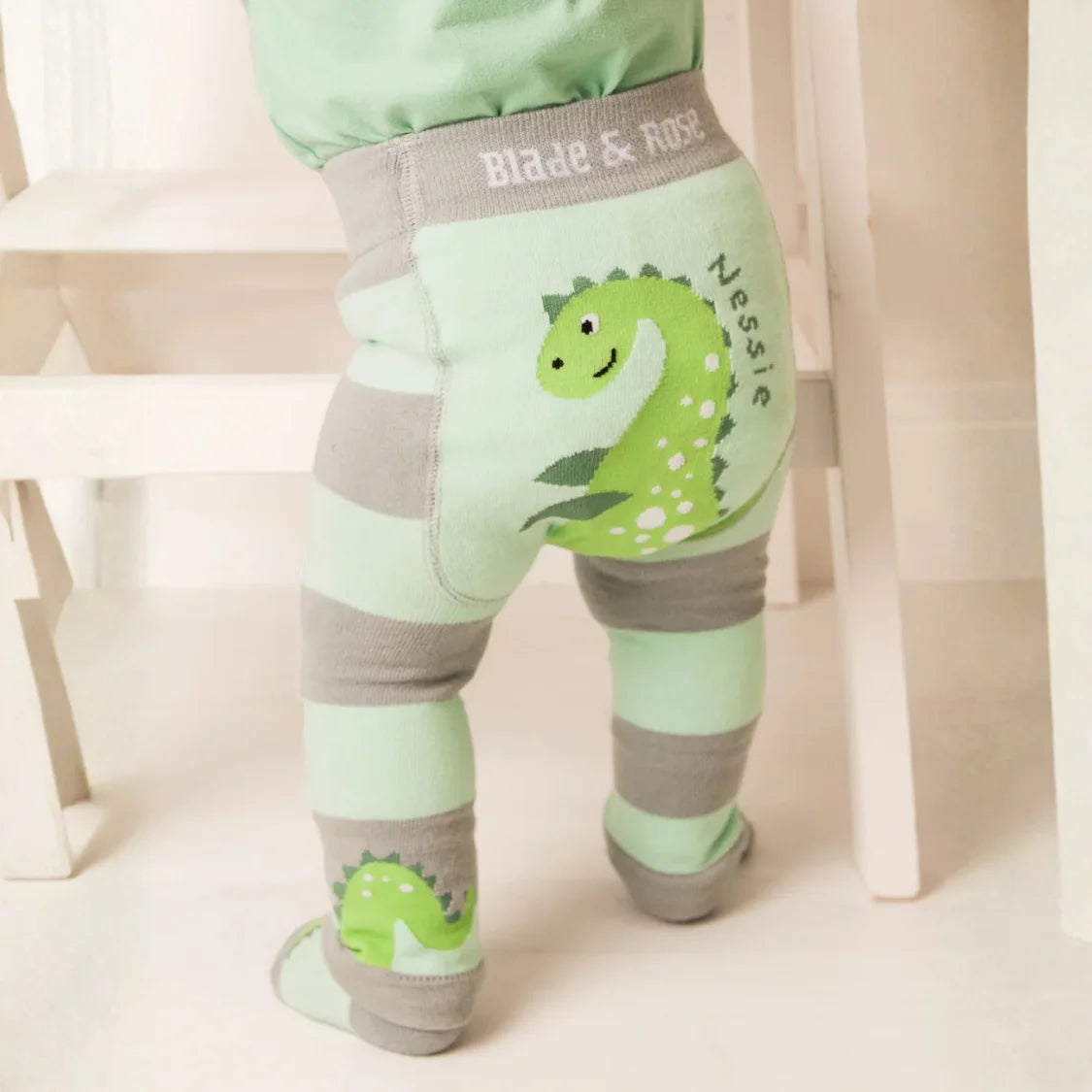 Children's leggings with dinosaur design and 'Blade & Rose' branding.