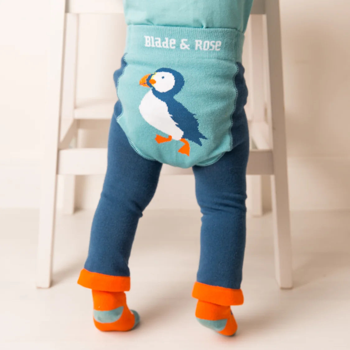 Children's leggings with a puffin design and 'Blade & Rose' branding, worn by a child.