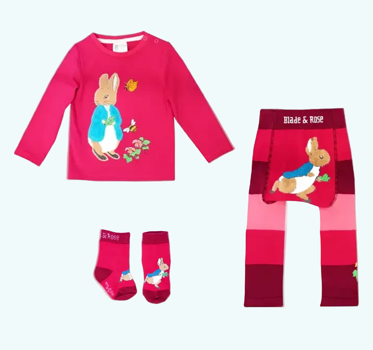 Children's clothing set with pink long-sleeve shirt, leggings, and socks featuring a rabbit design on a white background.