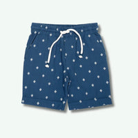 Blue shorts with white pattern on a light gray background