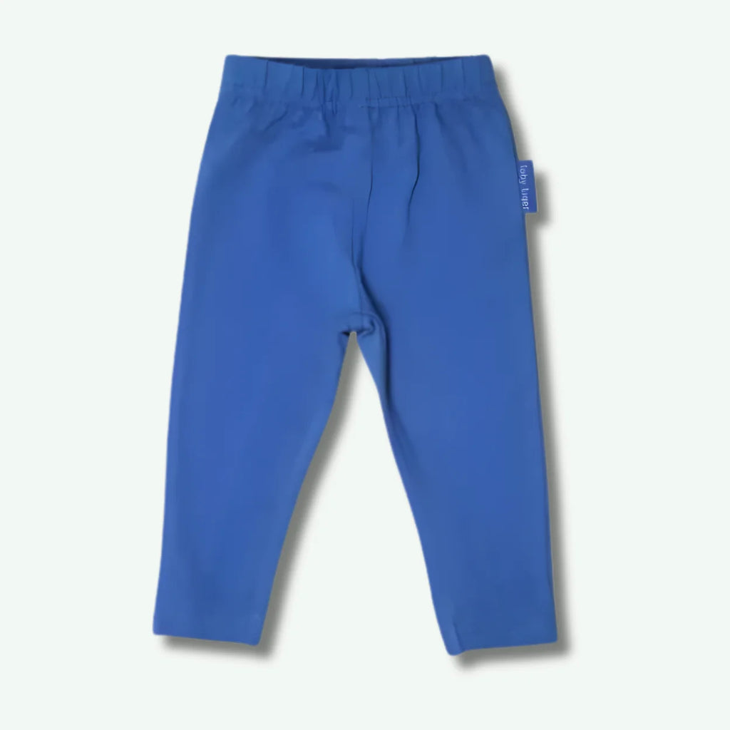 Blue pants with a tag on a light gray background