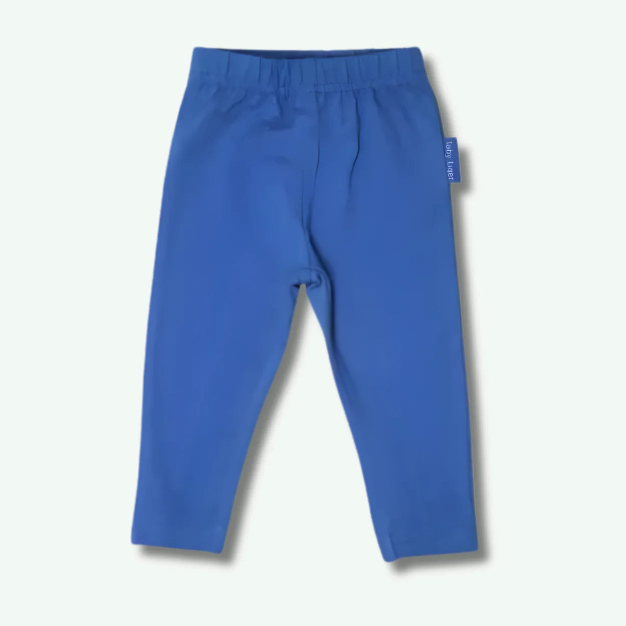 Blue pants with a tag on a light gray background