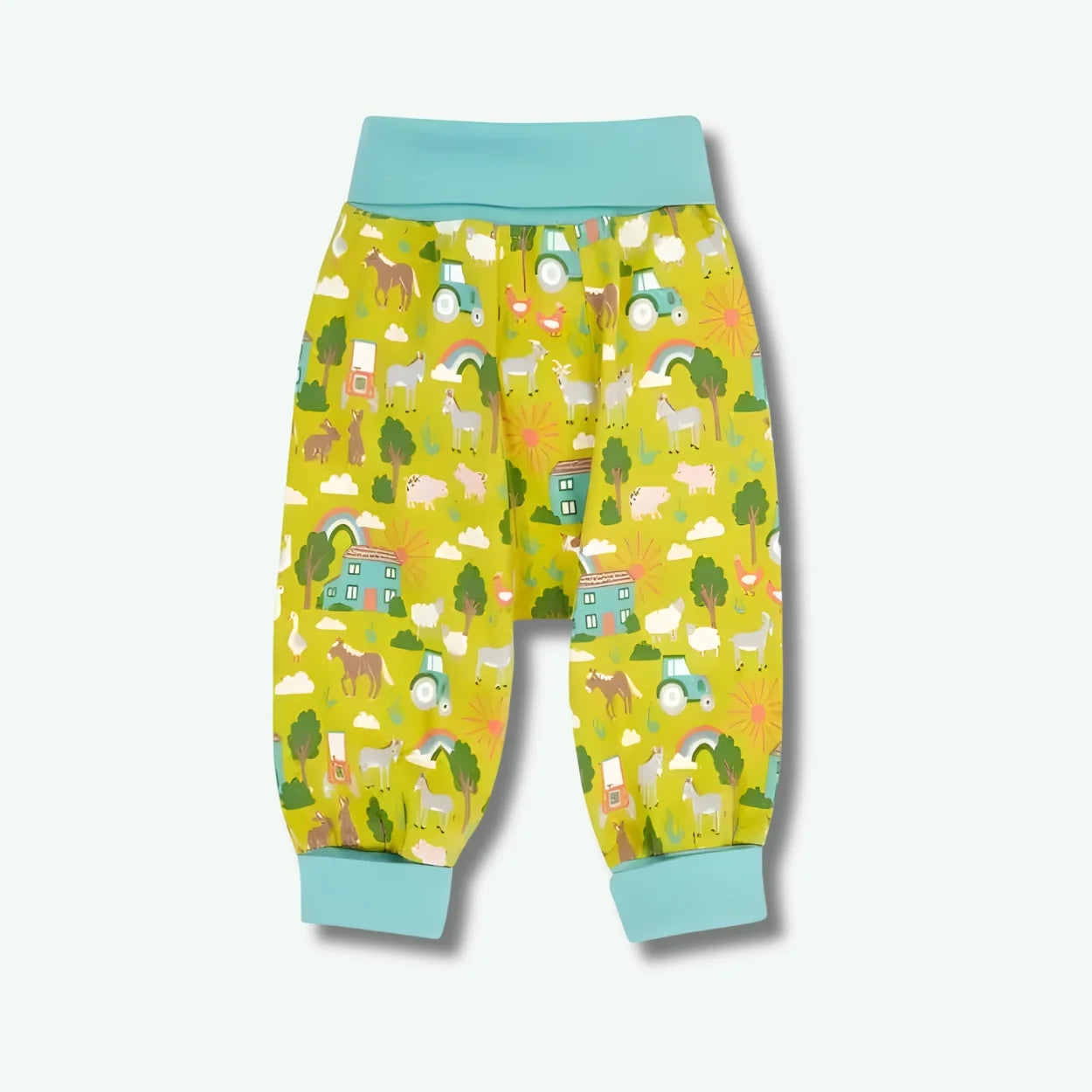 Colorful children's pants with animal pattern on a light gray background