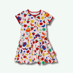Colorful children's dress with various patterns on a white background