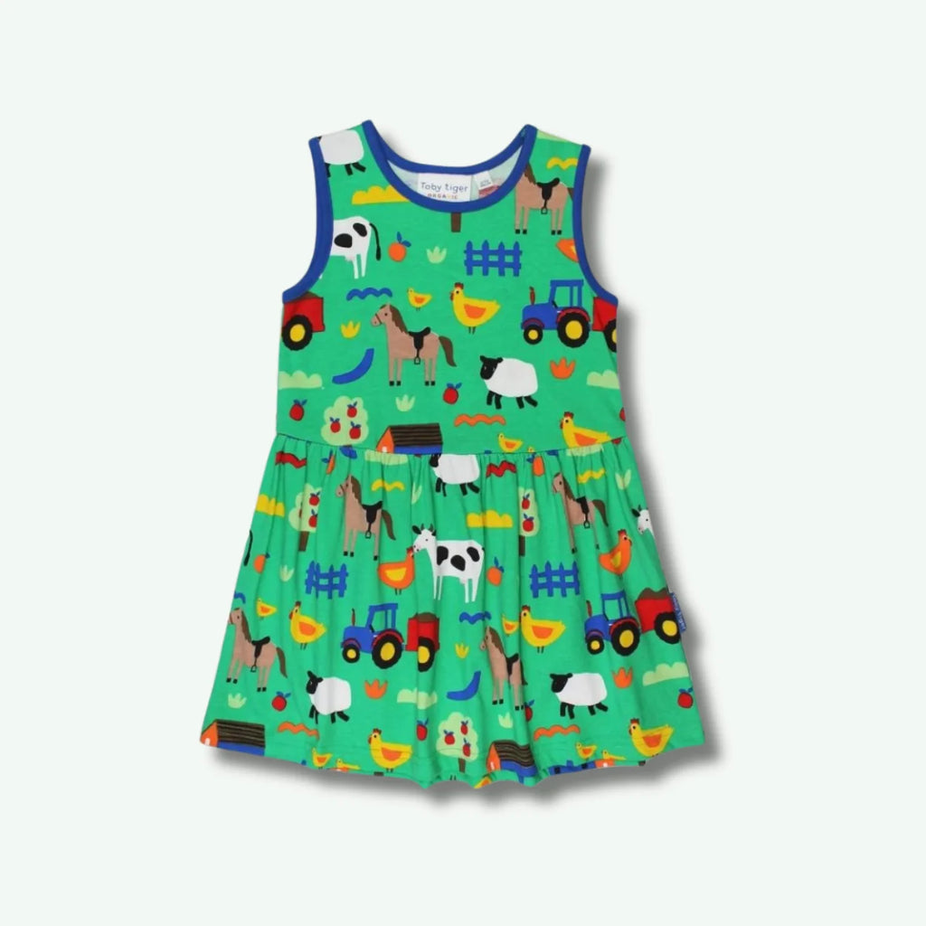 Children's dress with farm animal pattern on a white background