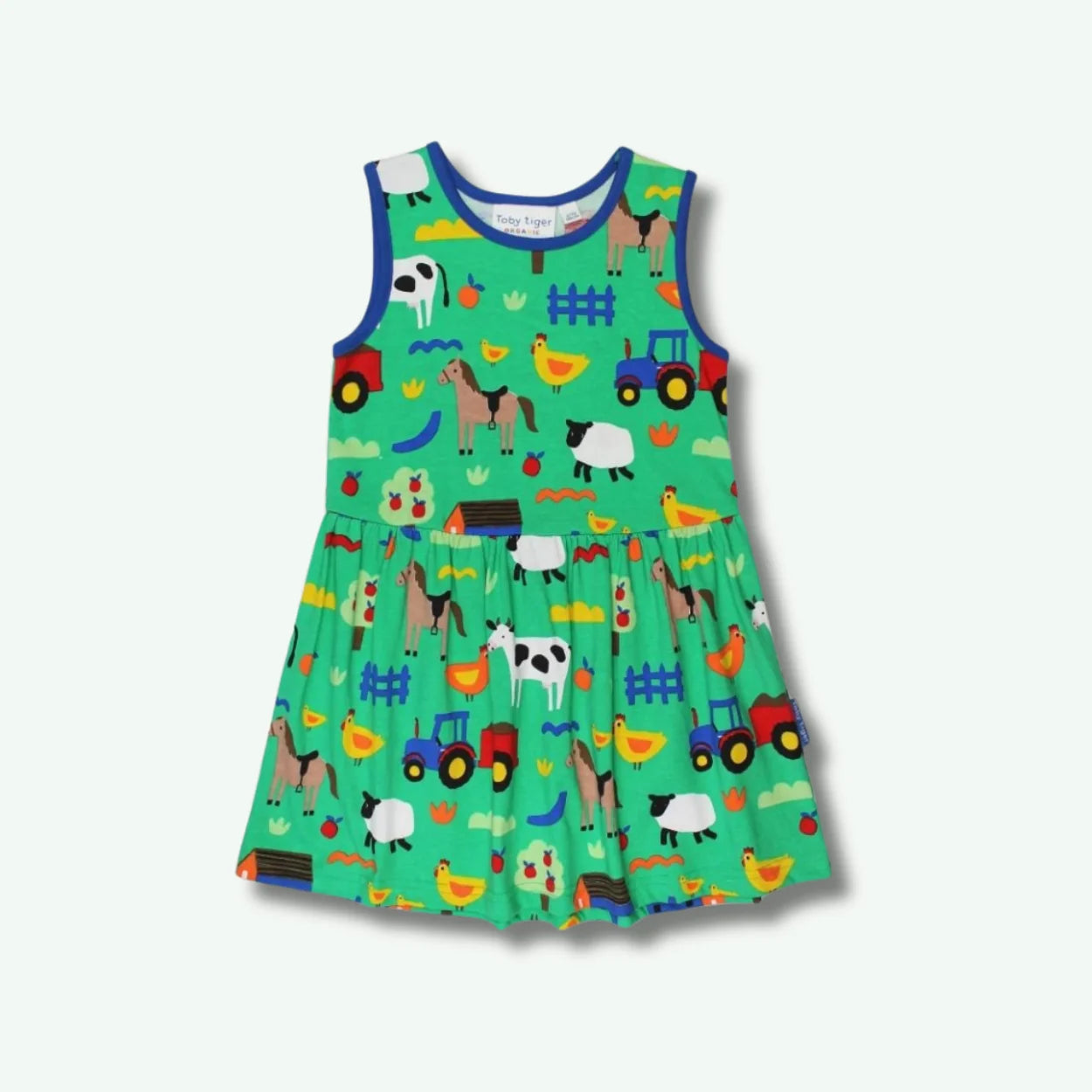 Children's dress with farm animal pattern on a white background