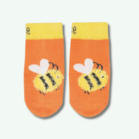 Pair of socks with bee design on a white background