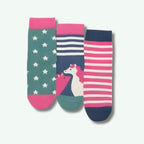 Three colorful socks with star pattern, striped design, and unicorn illustration on a light gray background.