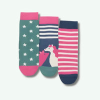 Three colorful socks with star pattern, striped design, and unicorn illustration on a light gray background.