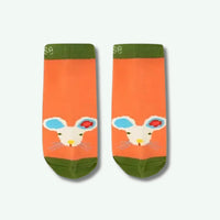 Pair of socks with a cartoon rabbit design on an orange background