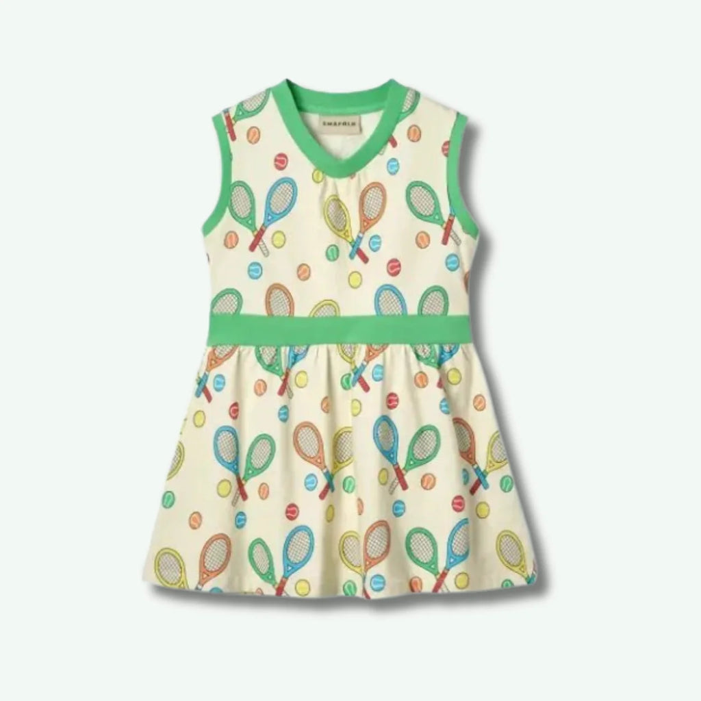 Children's dress with tennis racket and ball pattern on a white background