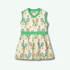 Children's dress with tennis racket and ball pattern on a white background